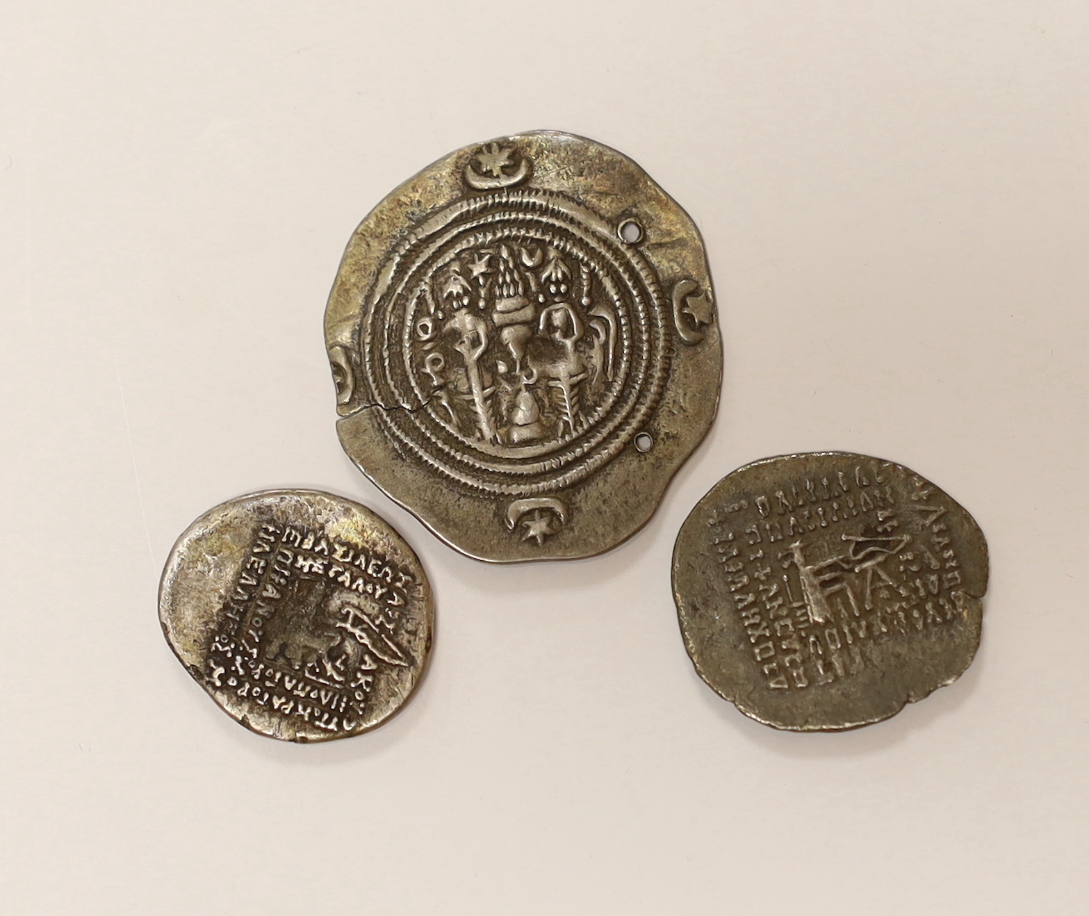 Sasanian Kingdom AR drachm, 4g, holed and clipped otherwise VF and Parthian Kingdom, two AR drachm, 3.45g and 4g, fine or better (3)